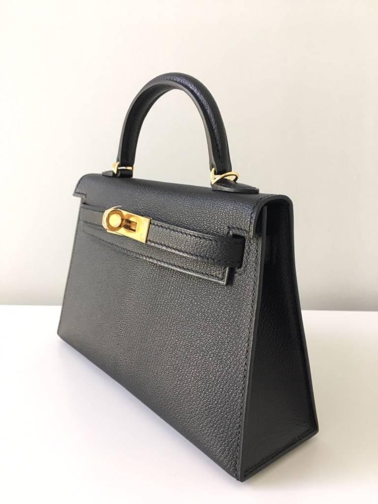 Ultra limited edition! 
Produced in very limited quantity for this year only!
Sold exclusively to super VIP clients!

Black Kelly Sellier Mini bag made of goat leather and accentuated with gold hardware. A must have collectors item!

Contact us for