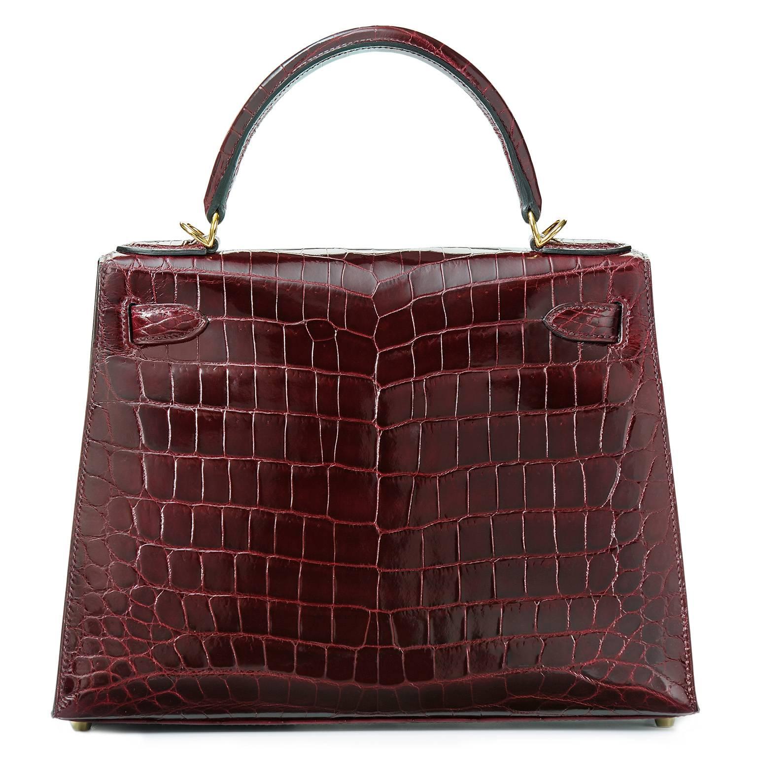 Stunning beauty!!!!
All time classic!!!

28 cm Kelly Sellier made of Niloticus Crocodile skin in Bordeaux with GOLD hardware!!!

This beautiful bag comes as a full set:
bag, clochette, lock, keys, shoulder belt, dust bags, rain protection