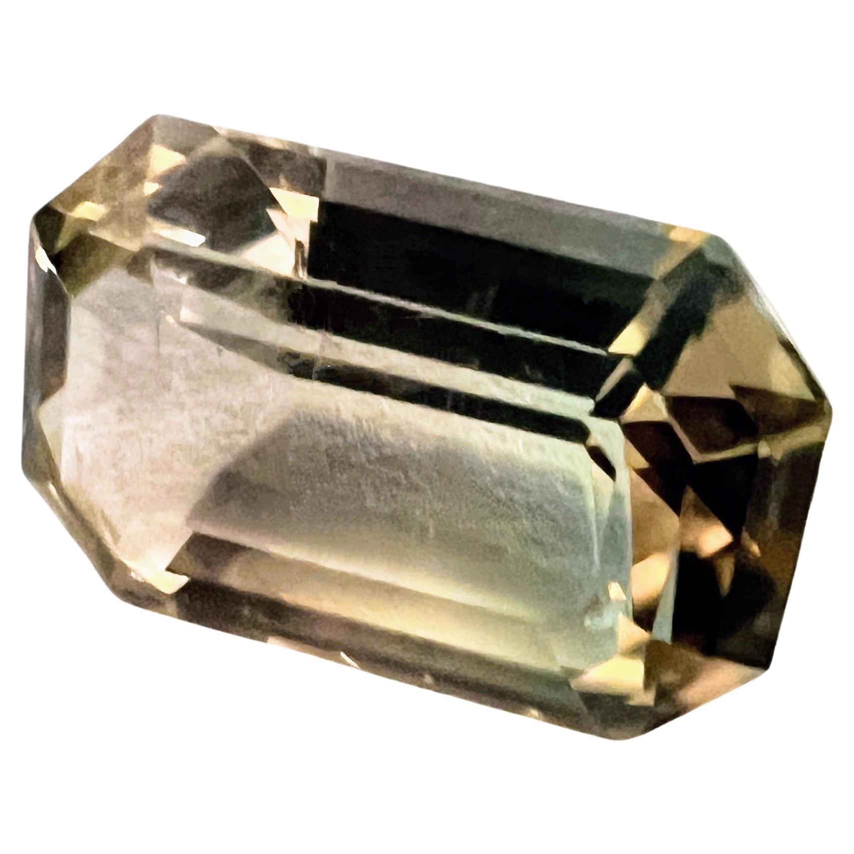 Feast your eyes on this 6.09ct Baguette Cut Bi-color Tourmaline – a stunning gem that showcases the incredible diversity of tourmalines.

What's special about this gem is its blend of two lovely colors: pinkish and greenish. It's like looking at a