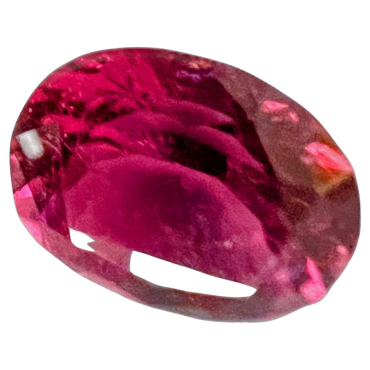 A Radiant Pink Dream in this rare 9.60ct Oval Pink Rubellite Tourmaline. Mother Nature herself has painted this tourmaline with the most dramatic shades of pink, from soft pastels to deep rosy tones, it's a masterpiece of pinkish hues that embodies