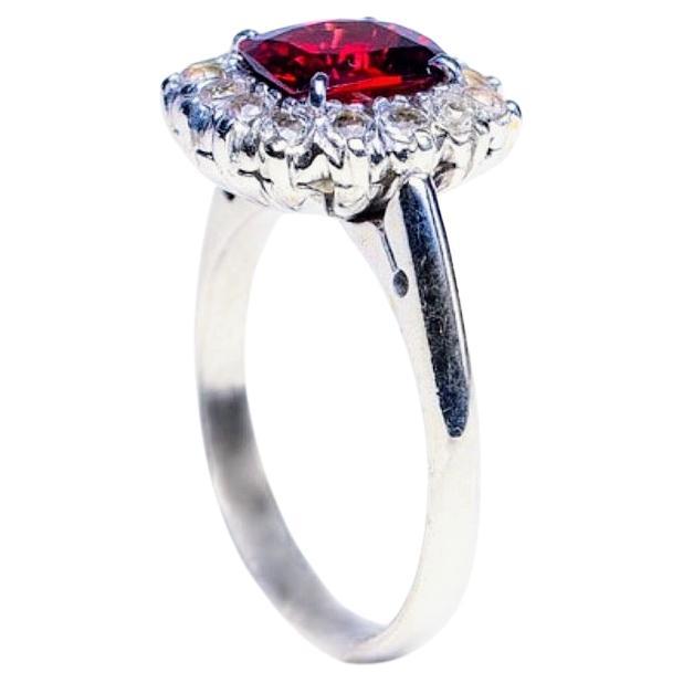 Indulge in the captivating allure of our 3-carat Rectangle Red Garnet Cocktail Ring surrounded by Sparkling Genuine White Zircon. This exquisite piece combines the boldness of a genuine red garnet with the timeless elegance of a sleek rectangular