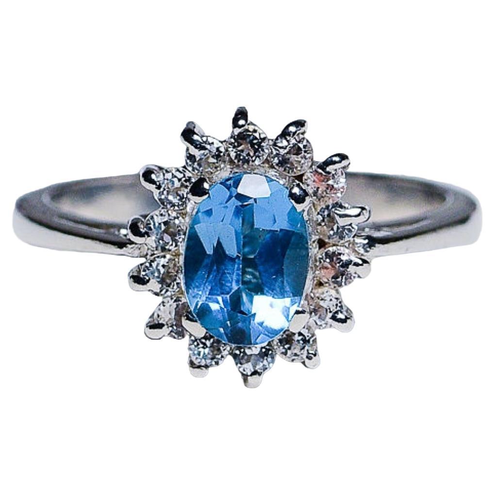 Bague en argent platiné avec topaze bleue ovale de 1ct 