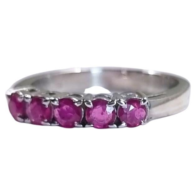 Introducing our 1.25CTW Round Pink Sapphire Platinum Silver Band Ring, a stunning piece that exudes elegance and sophistication. This ring features a mesmerizing 5X .25ct Round Pink Sapphire at its center, known for its captivating pink hue and