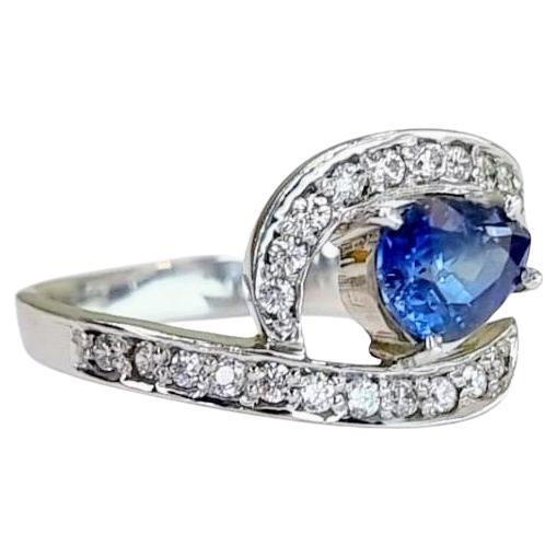 Introducing our breathtaking 1ct Pear-shaped Natural Blue Sapphire Ring, embraced by a halo of shimmering white natural zircons.

This exquisite ring is a harmonious blend of timeless design and contemporary sophistication, creating a piece that