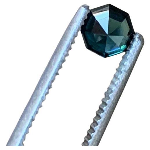 Unveil our classic Loupe Clean 1.5ct Asscher Cut Natural and UNHEATED Blue Sapphire, a symbol of sophistication and refined taste. This loose natural gemstone has been meticulously sourced and expertly cut to enhance its inherent beauty. The
