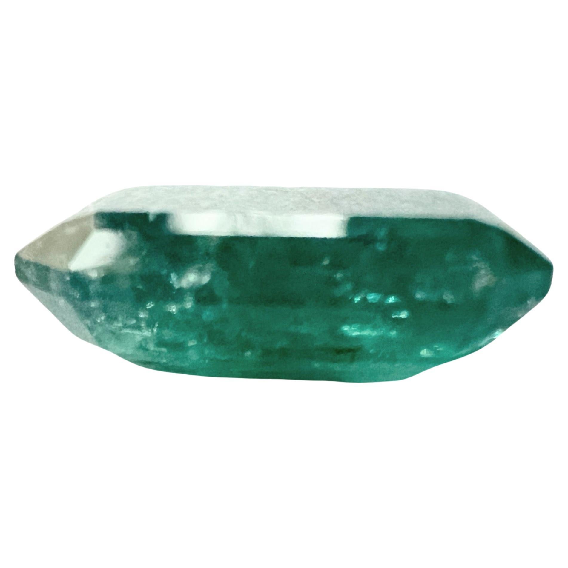 Behold this 7.90ct Non-Oil Natural Green Emerald Gemstone, a true work of nature's artistry. This gem boasts not only amazing clarity but also features artistic and masterful inclusions, adding a unique and captivating dimension to its