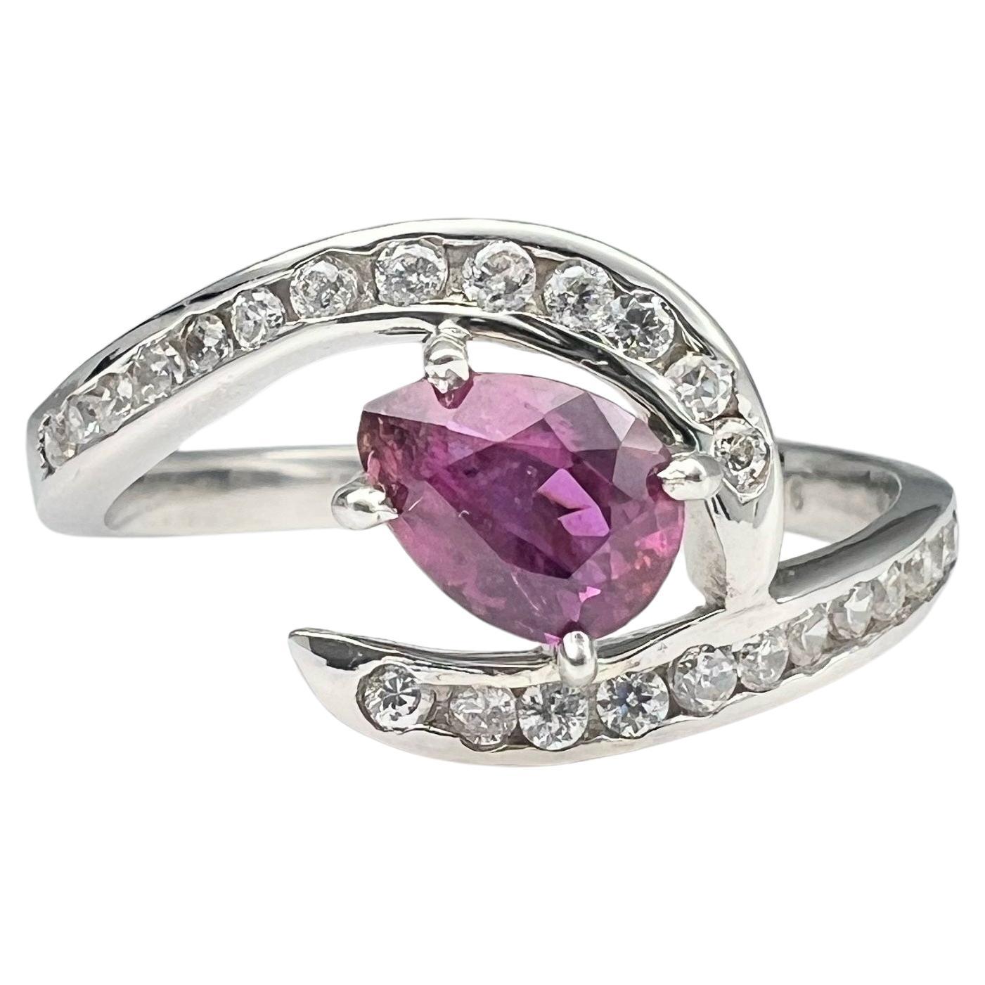Indulge in the ethereal beauty of our 1.5ct Pear Cut Natural Pink Sapphire Ring. This exquisite gem, with its captivating pink hue and graceful pear shape, is a true masterpiece of nature. Set in a delicate yet elegant band crafted from