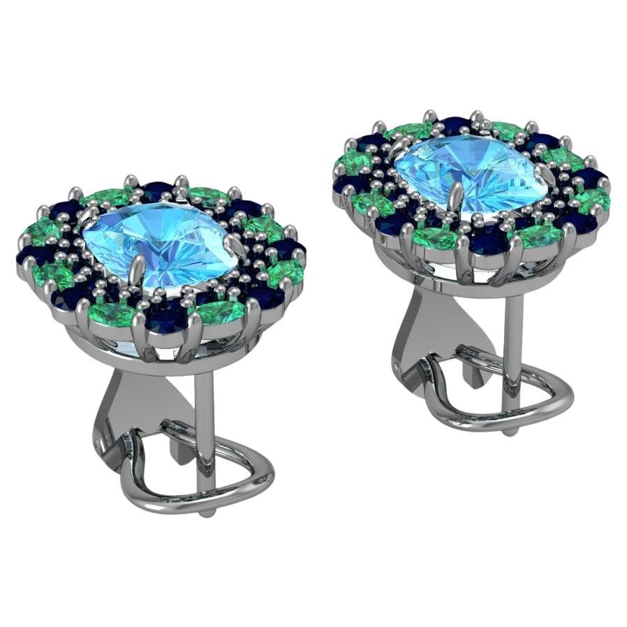 Custom Swiss Blue Topaz Lever-Back Earrings in Platinum with Sapphire and Emerald Halo

These exquisitely designed lever-back earrings combine premium gemstones with the timeless elegance of platinum. At their heart, a 9mm x 7mm cushion-cut Swiss