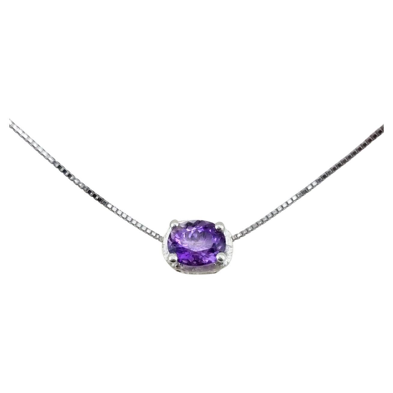 Oval-Cut Amethyst Pendant Necklace in Sterling Silver

This sophisticated pendant features a 9x7mm oval-cut natural amethyst, radiating a vivid purple hue that captivates with its depth and brilliance. The gemstone's classic oval shape is enhanced