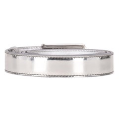 Ceinture Prada en cuir métallisé avec boucle arborant le logo triangulaire « Prada »