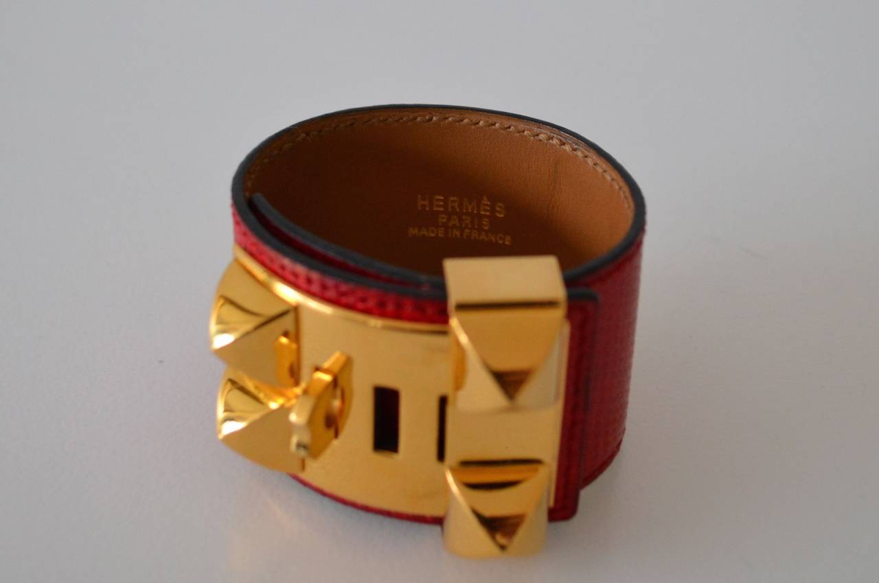 Hermes Collier de Chien CDC Lizard Rouge Braise bracelet
Lizard skin 
Rouge Braise color
Gold plated hardware
Hermès Paris Made In France 
 
3 positions
Very good condition
Hardware are gently used 
Dimensions : 7.8 x 1.8 inches
  
All