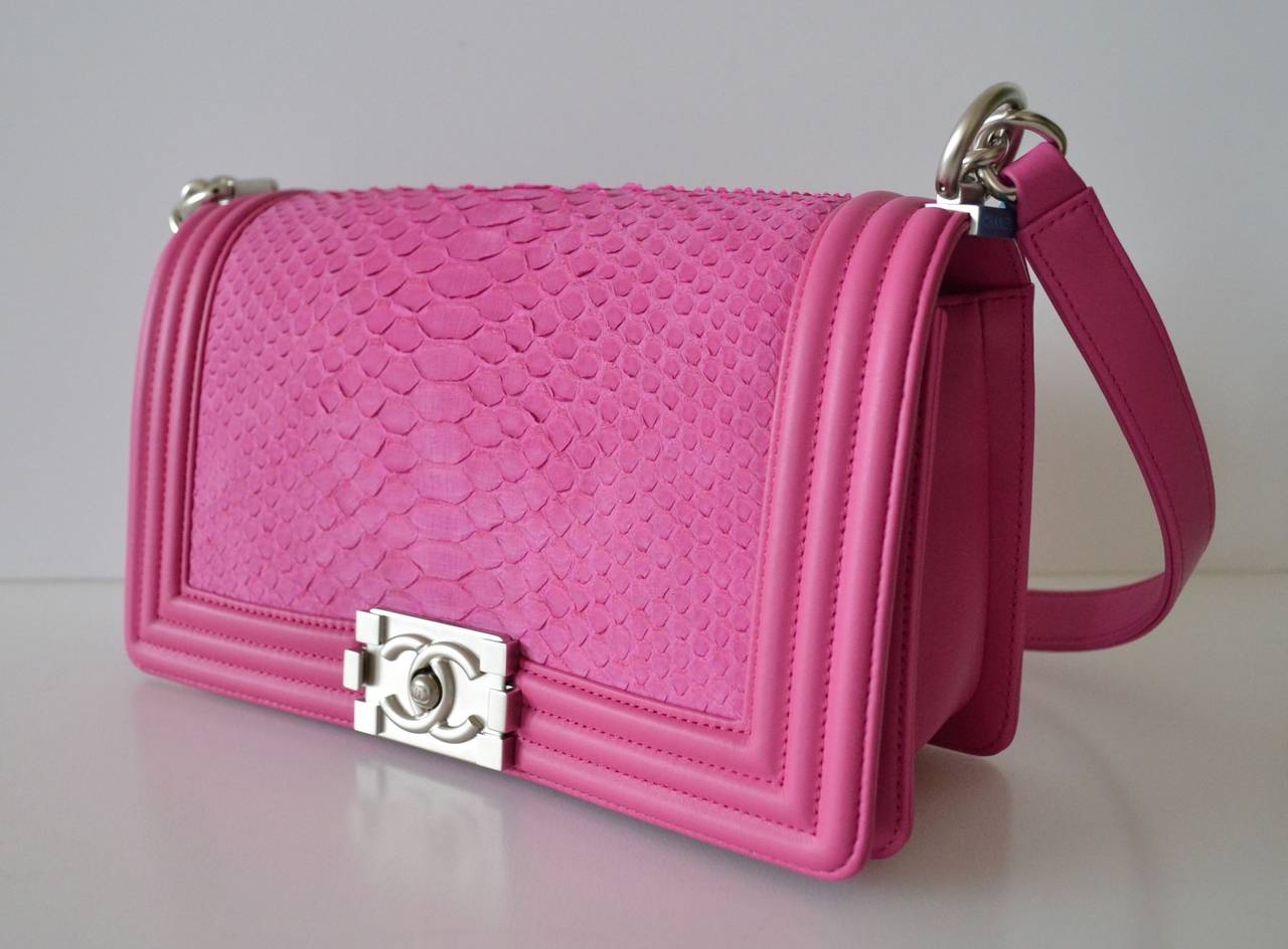 Chanel Boy Pink Python mat
 
Sold out color
New condition – never used
Genuine Python skin
Pink shoking color
Silver metal chain
 
Front CC logo pushlock
Interior lined in pink lambskin
Single inner slip pocket
 
Chanel Made in
