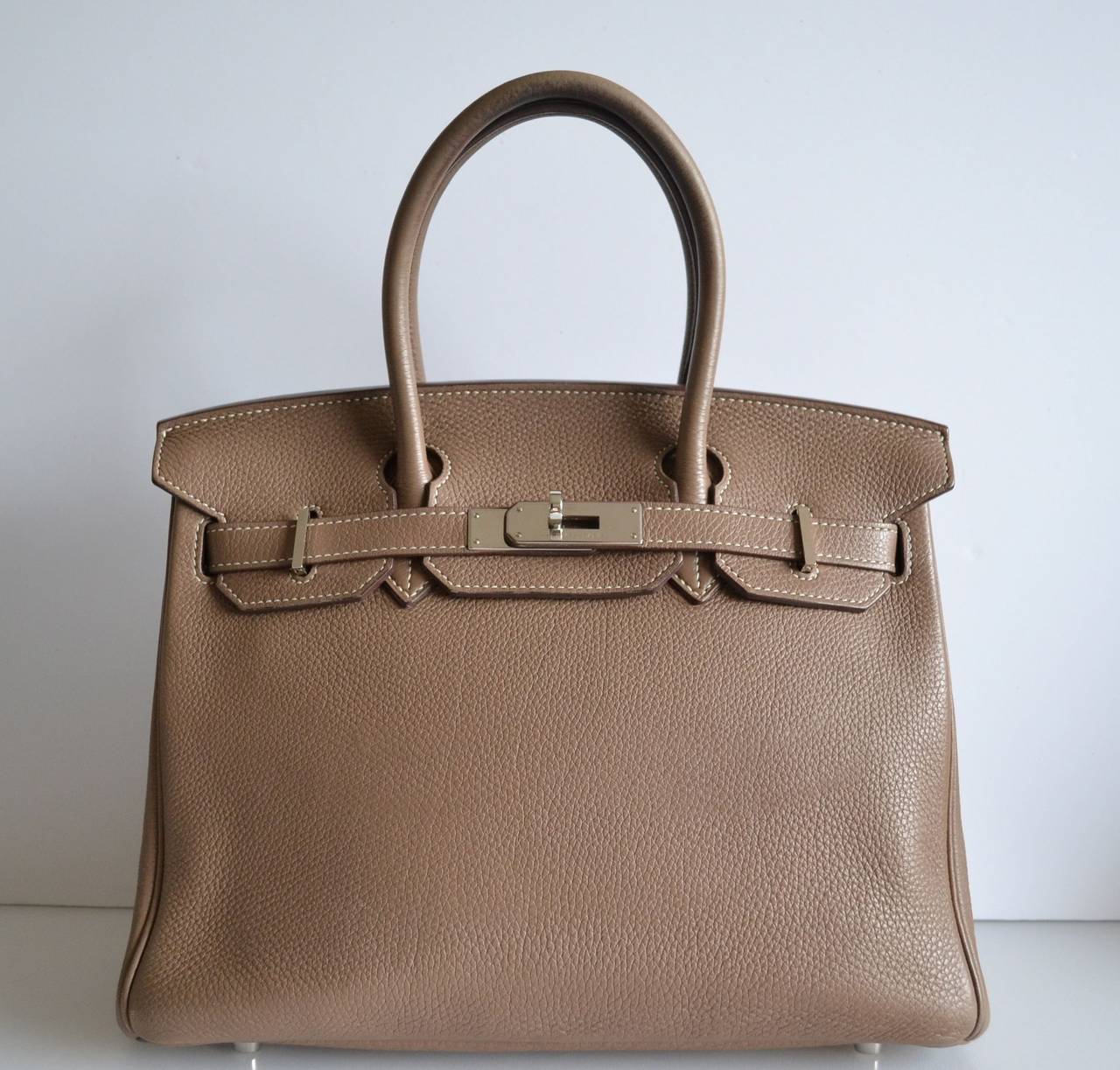 Hermes Birkin 30 Togo Etoupe
 
Togo leather with palladium hardware
 
Good condition
Stamp N
Hermes Paris Made In France
 
Togo leather is in very good condition - Interior is odorless - Corners are good - Hardware is in very good working –