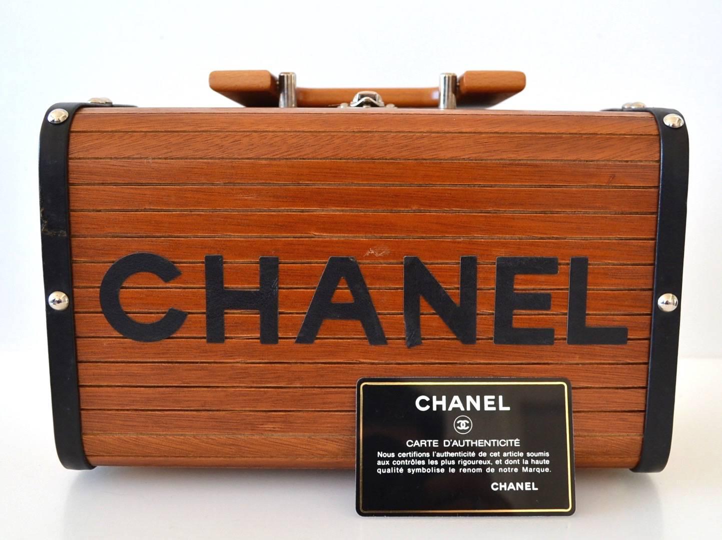 Chanel Limited Edition 1996
Collector piece
Natural wood Chanel mini trunk
Silver hardware with a flap wooden top handle.
Chanel letters in lamb skin
Burgundy lining with Chanel writting and hologram 3986334
Zippy pocket inside
 
Authenticity card