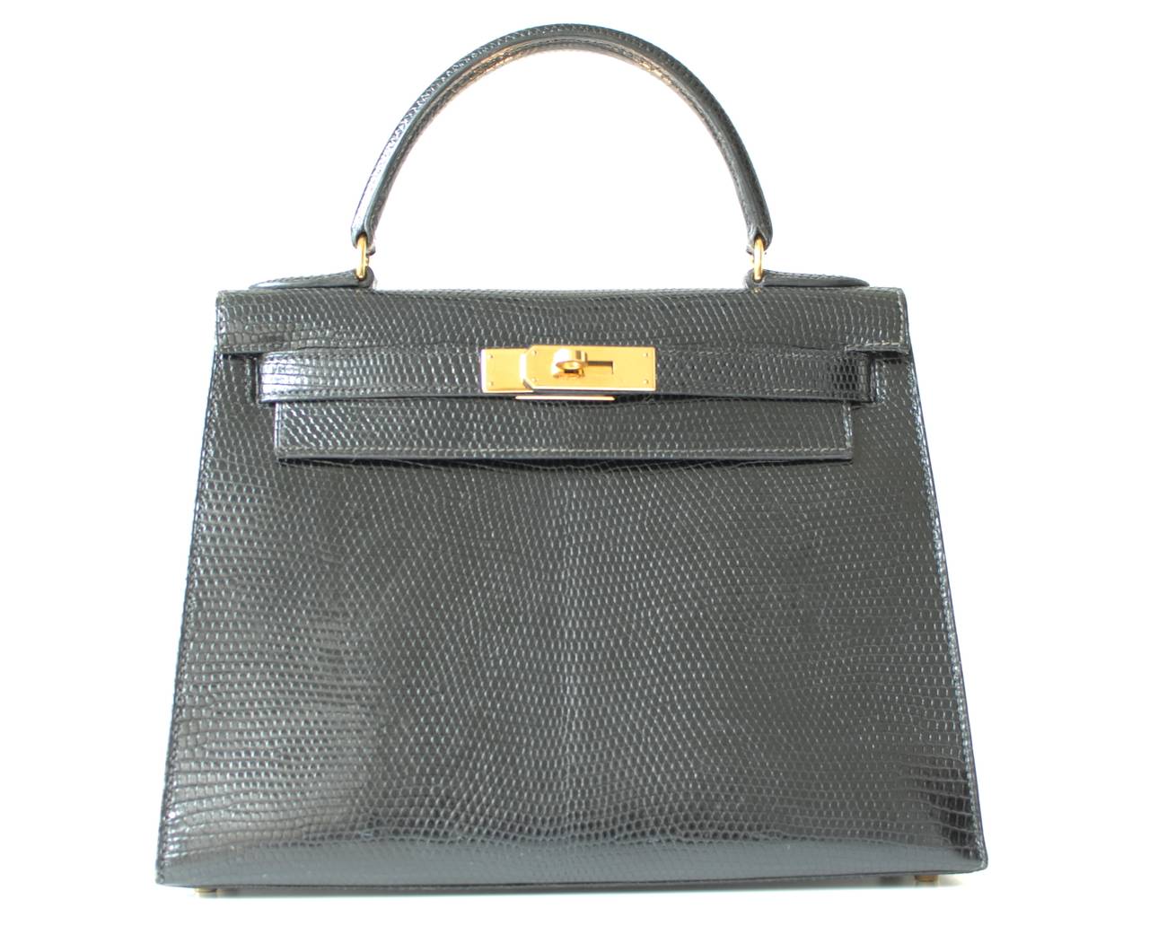 Hermès Kelly 28 Lizard Black color
 
Lizard skin
Black color
Gold plated hardware
Hermès Paris Made In France
 
This bag is in mint condition and comes with lock and strap.
The stamp is Z in circle for 1996.
As you know, Hermes no longer