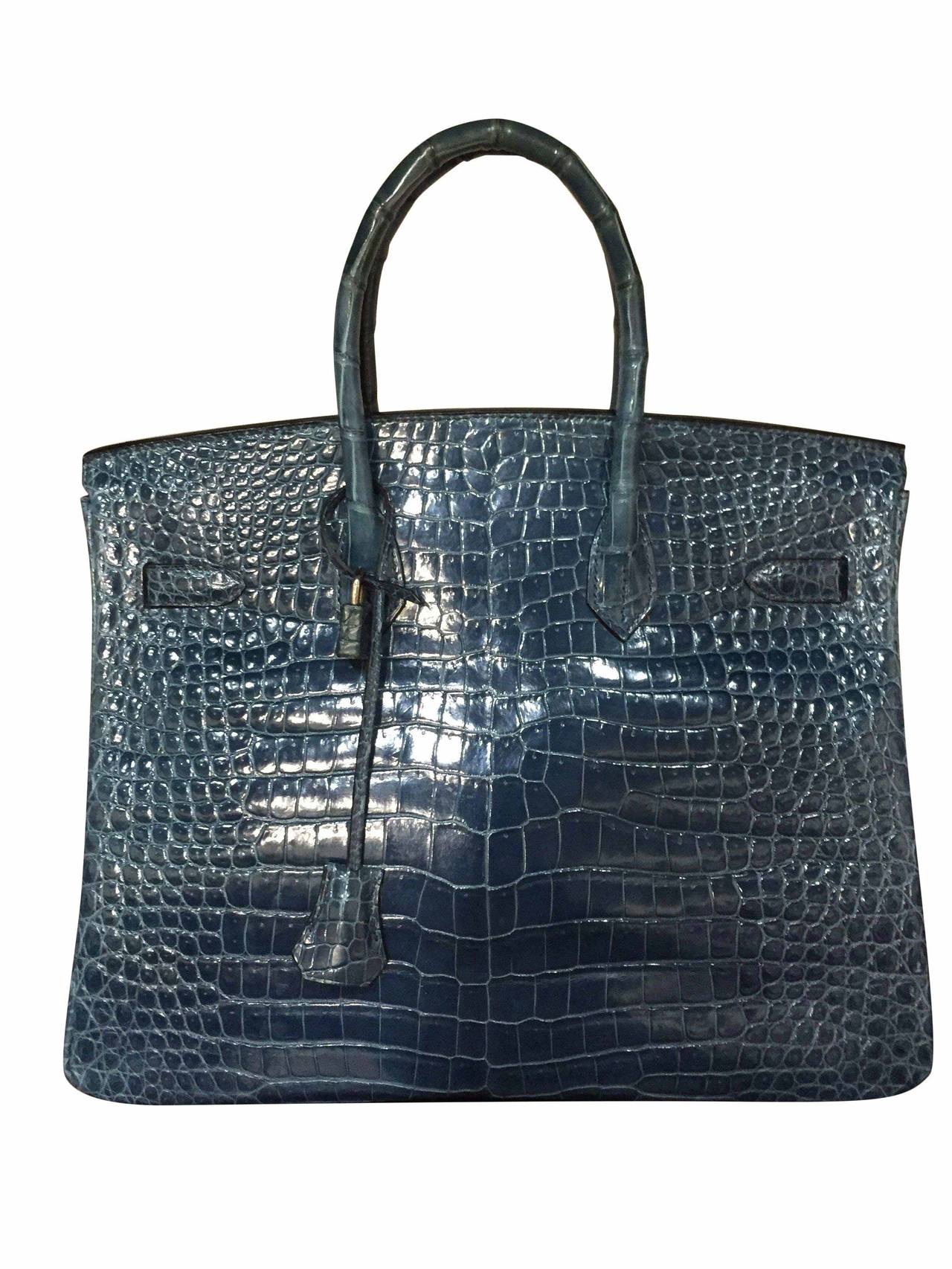 Hermès Birkin 35 Crocodile Porosus
Bleu Abysse
Chevre lining
Palladium hardware
 
Stamp K in square
Hermès Paris Made in France.
 
Skin is 9/10.
No scratches
Corners are excellent. Odorless.
Safe shipping.
100% Authentic – Trusted