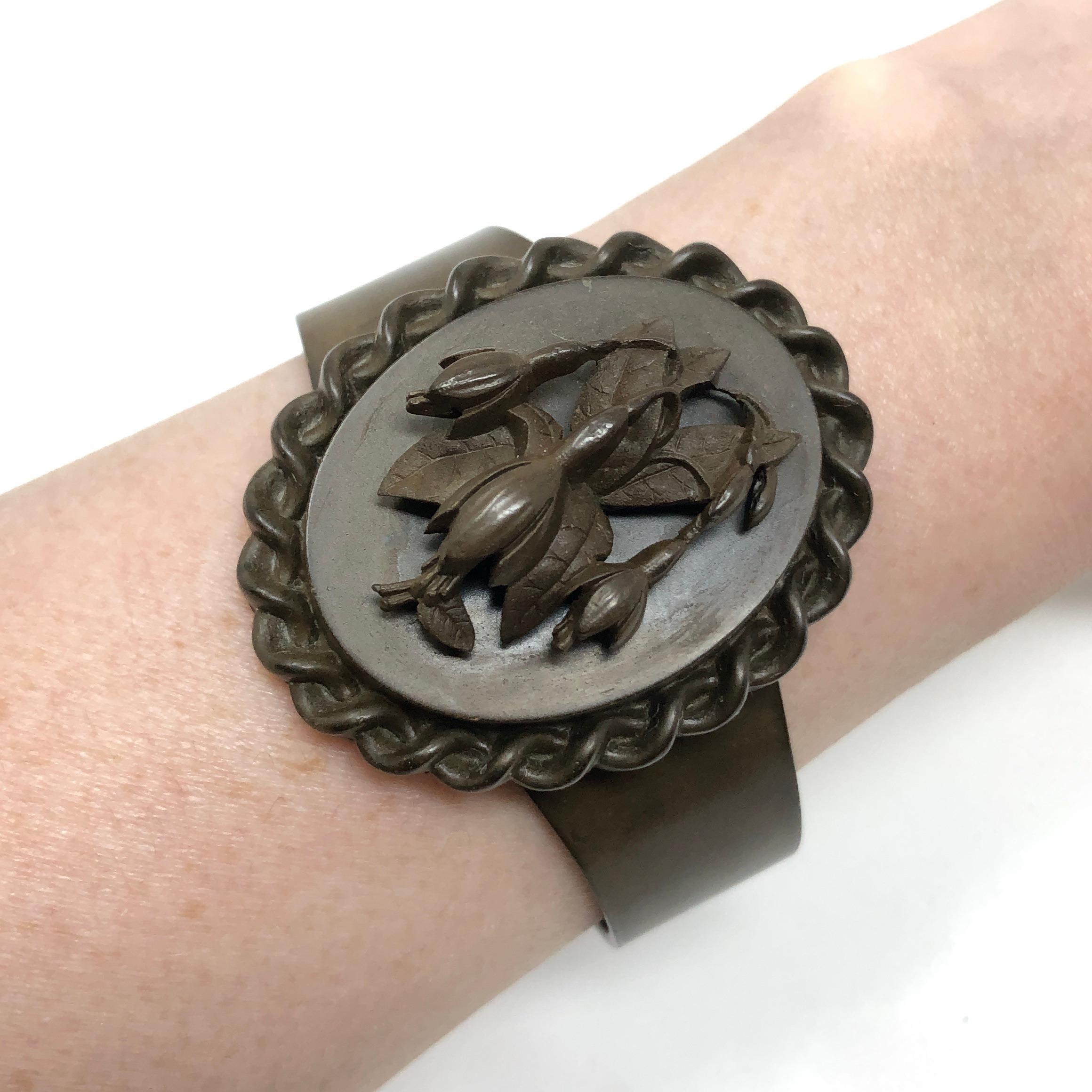 Beautiful and evocative, this bracelet was created from Vulcanite in the late 1800s. 

Condition Report:
Very Good - A little rusting to the fixings on the inside of the cuff. This is consistent with age, is not visible when the cuff is worn and