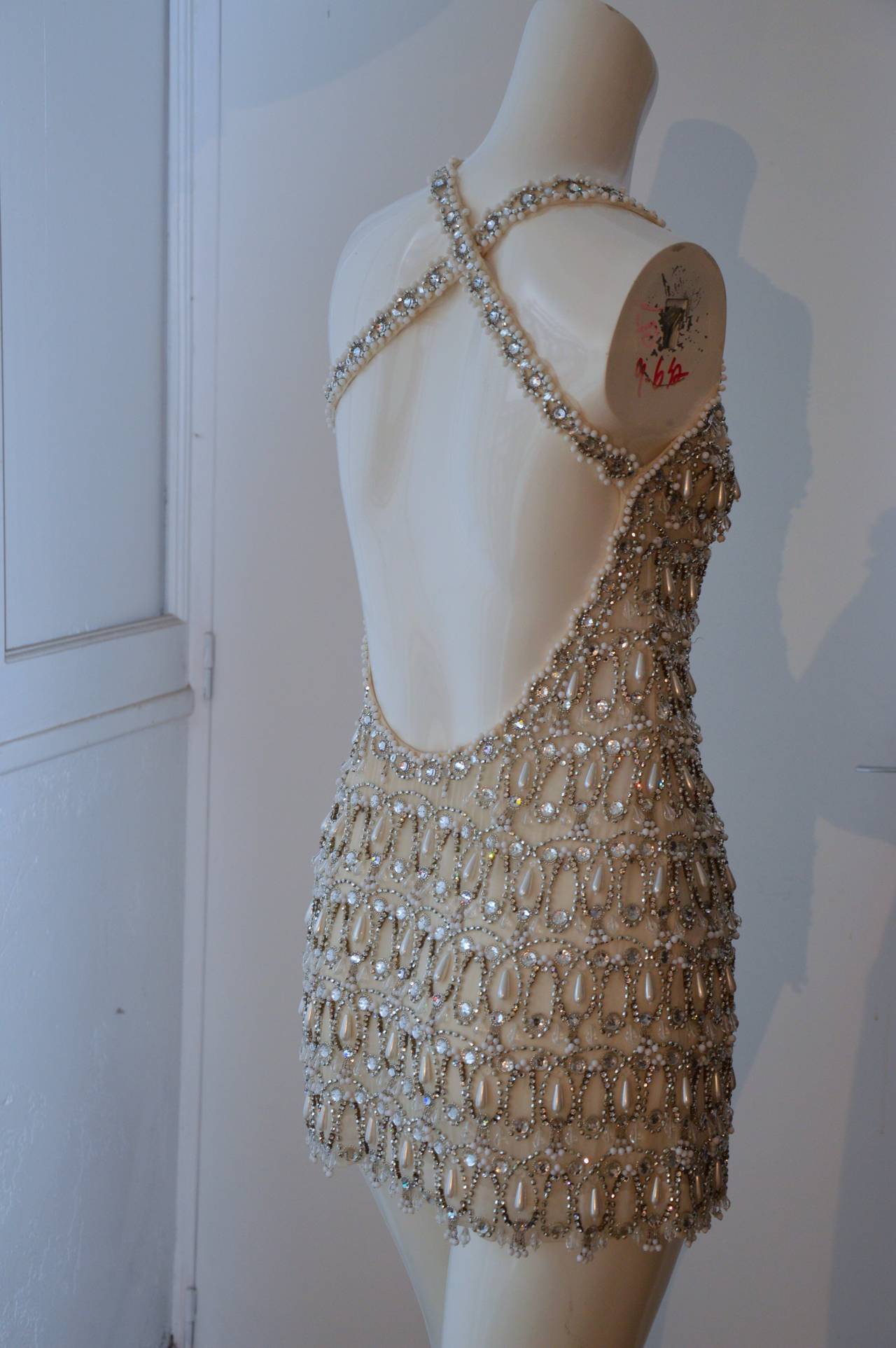 This sumptuous mini Chanel dress is really spectacular, its made of white silk chiffon with 