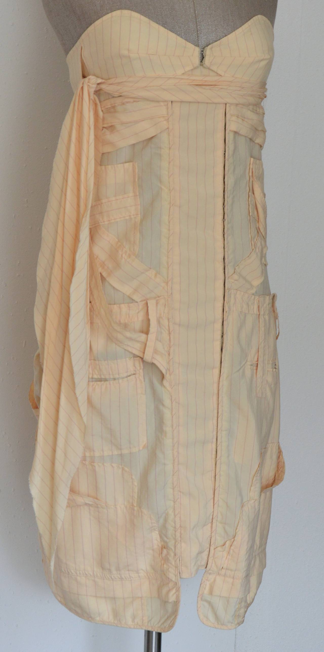 Fine light beige or powder pink bustier dress with thin striped suit motif. Silk and rayon, european size 36 / XS for US.