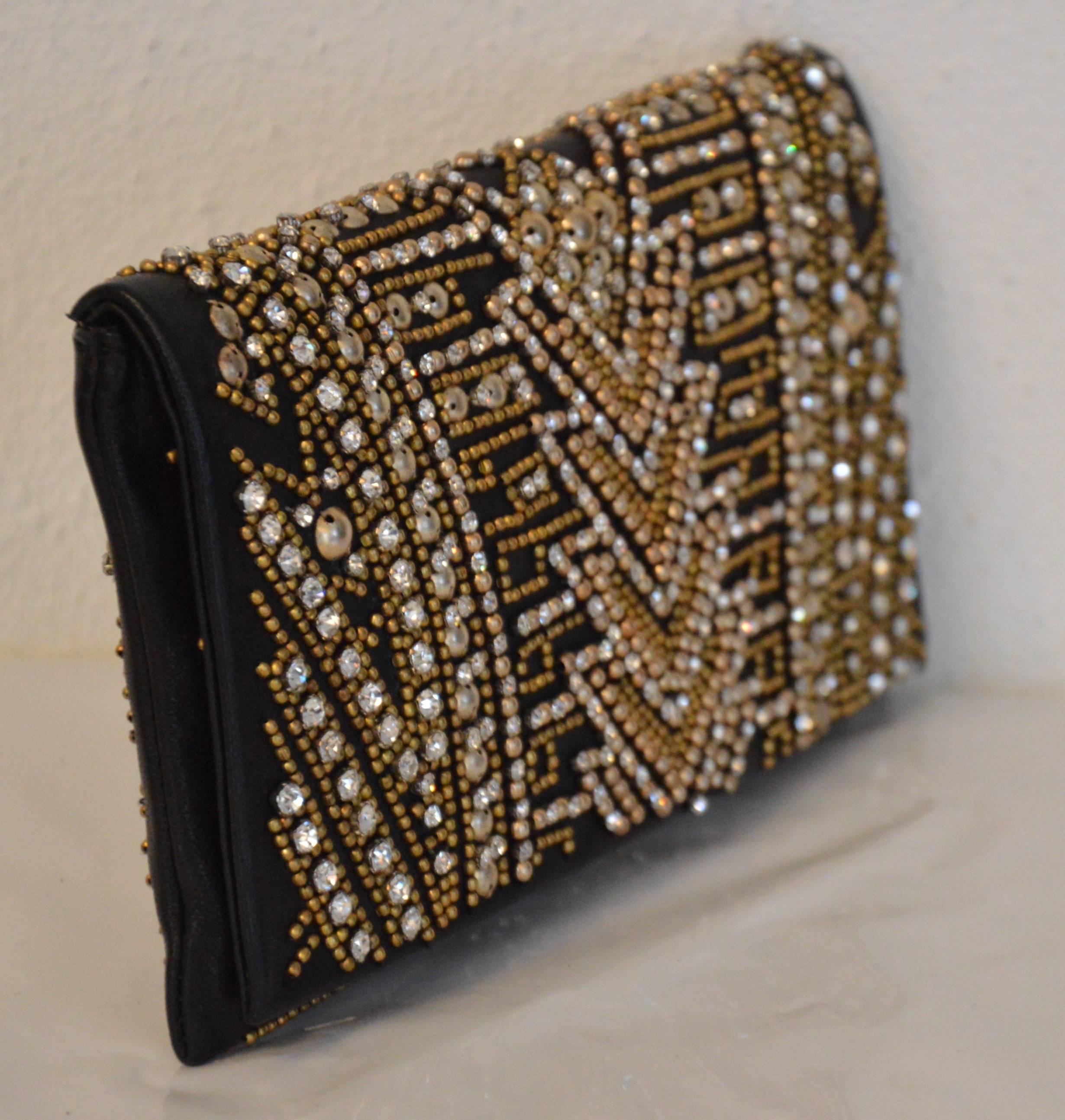 Very rare evening bag, very luxurious, patinated golden studs, strass, both different size, geometrical abstract patterns a discreet allusion to Far-West as the theme of the Spring 2012 collection, first Rousteing collection for Balmain. perfect