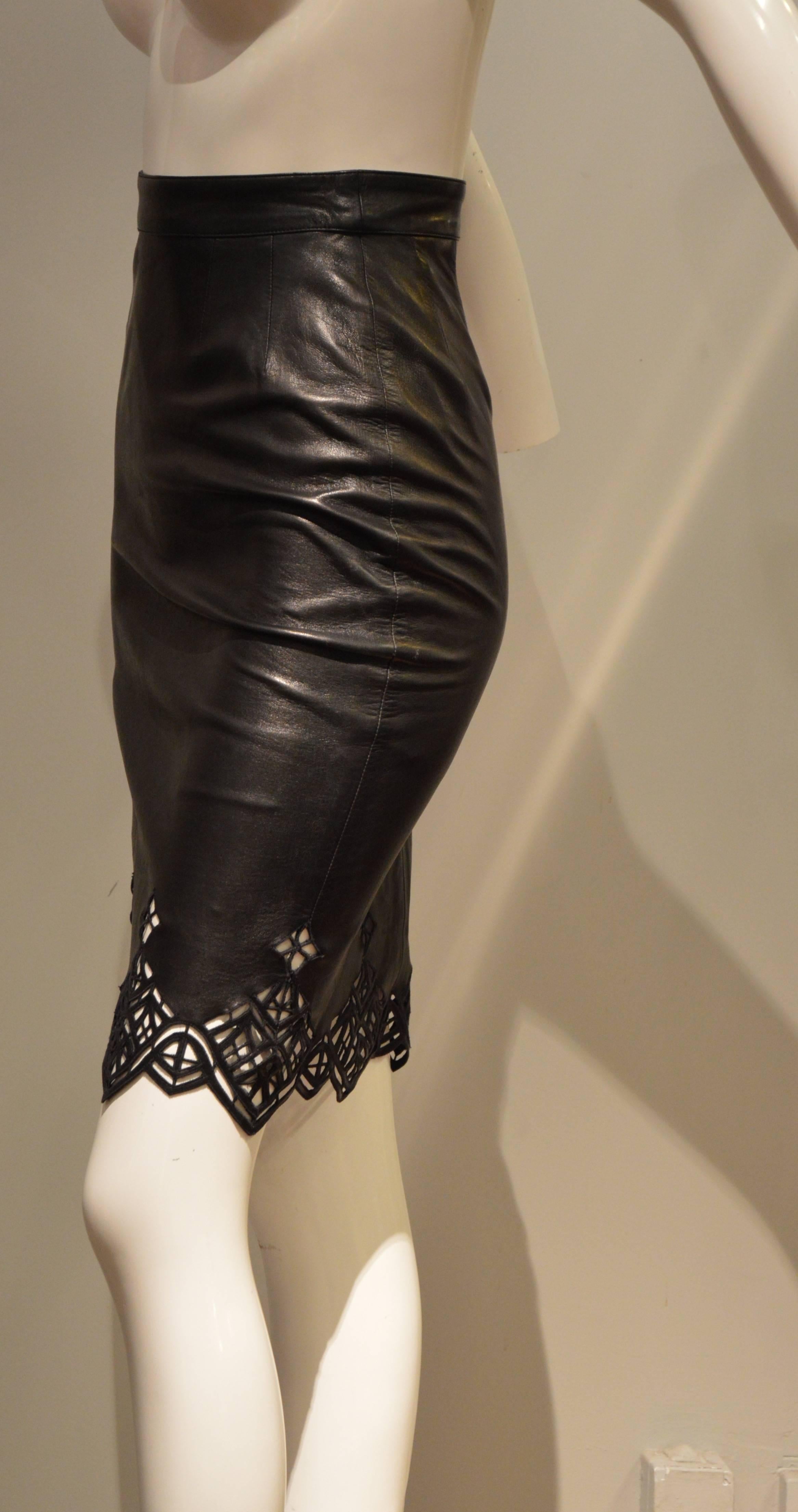 This Nina Ricci Haute Boutique pencil leather skirt is a dream. The leather souple but strong, deep black with edgy cut outs at the bottom redefines luxury with delicacy. You will find with the haute boutique Nina Ricci tag a "Atelier