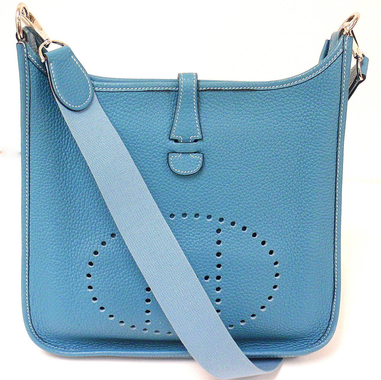 HERMES EVELYNE PM BLUE JEAN TOGO LEATHER GHW SHOULDER BAG, 2004
This bag is in GREAT MINT condition. Features thick soft togo leather exterior with sueded leather interior. 
Color will vary from monitor to monitor.
Exterior: Minty.

Strap is
