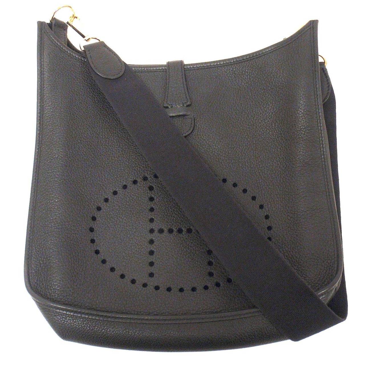 HERMES EVELYNE GM BLACK CLEMENCE LEATHER GHW SHOULDER BAG, 2003

 This bag is in EXCELLENT, NEAR MINT condition. Features sturdy but oh so soft and supple (and slouchy) black leather exterior with sueded leather interior.

Please note, color can