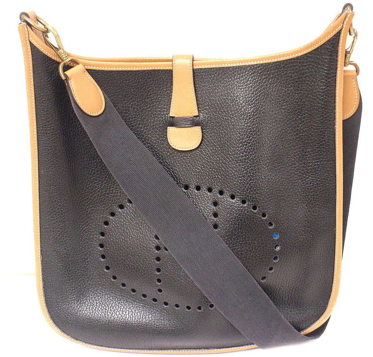 Hermes Evelyne GM two-tone black Clemence Barenia leather GHW shoulder bag, 1989!

This bag is in GREAT condition. Very rare color combination. Features soft leather exterior with sueded leather interior. Black clemence leather accented with