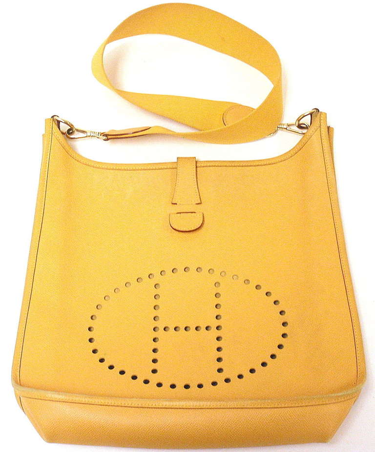 Hermes Evelyne GM sunny-yellow Ardenes leather GHW shoulder bag, 1998

 This bag is in good condition. Features sturdy but oh so soft and supple leather exterior with sueded leather interior.

Please note, color can vary greatly from monitor to