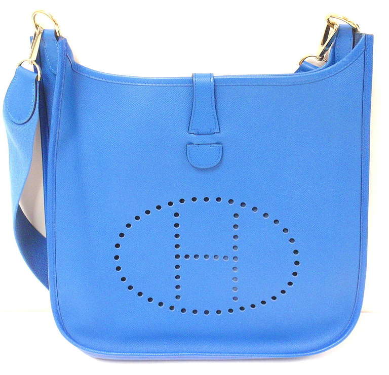 HERMES EVELYNE GM ELECTRIC BLUE EPSOM LEATHER GHW SHOULDER BAG, 2000

This bag is in excellent condition. Features soft leather exterior with sueded leather interior. Electric Blue epsom leather with matching canvas strap.

Please note, color