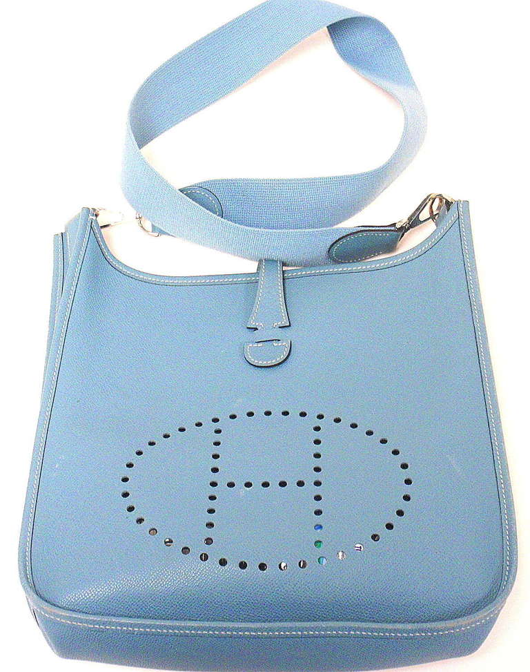 HERMES EVELYNE PM BLUE JEAN EPSOM LEATHER SHW SHOULDER BAG, 2005

 This bag is in GOOD condition. Features sturdy blue jean epsom leather exterior with sueded leather interior. blue strap.

Signature Hermes Blue Jean color.

Exterior: Scuffing
