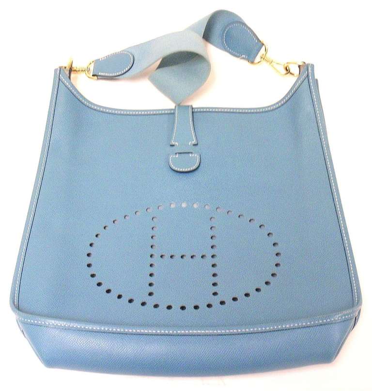 HERMES EVELYNE GM BLUE JEAN EPSOM LEATHER GHW BAG, SHORT STRAP, 1998

This bag is in GREAT condition. Features firm and sturdy epsom exterior with sueded leather interior. True blue jean leather with matching canvas strap.

Please note, color