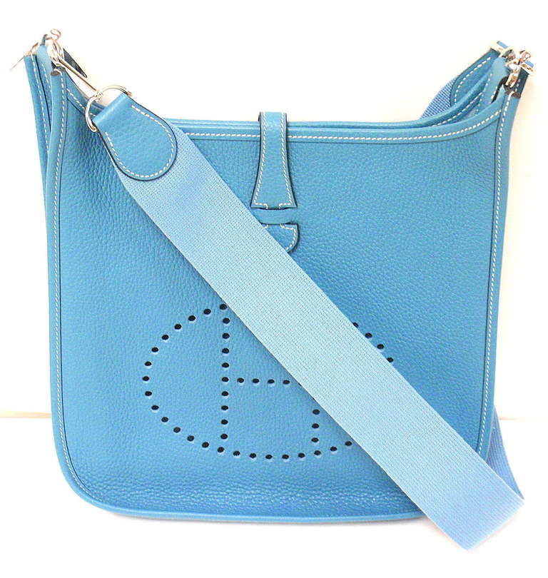 HERMES EVELYNE PM BLUE JEAN CLEMENCE LEATHER SHW SHOULDER BAG, 2005

Comes with dustbag.
 This bag is in MINTY condition. Features sturdy thick and soft clemence leather exterior with sueded leather interior. Matching strap. Classic sky blue