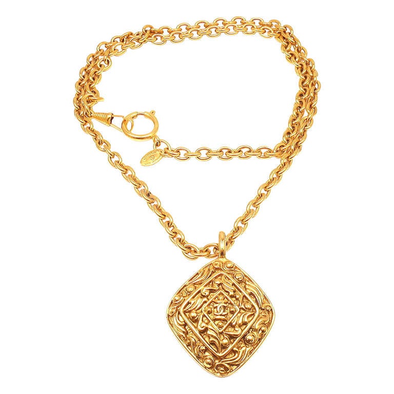 CHANEL Vintage Long Textured Amulet Logo Necklace
