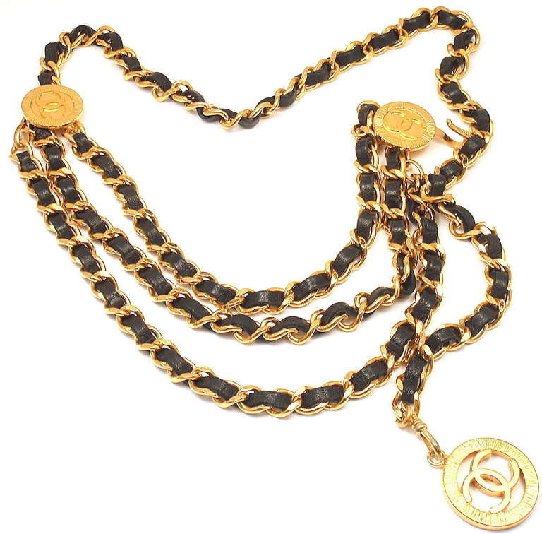 Vintage French Couture Collection Gold Tone Black Leather Signature Long Necklace or Belt from CHANEL. 

Length: 36
