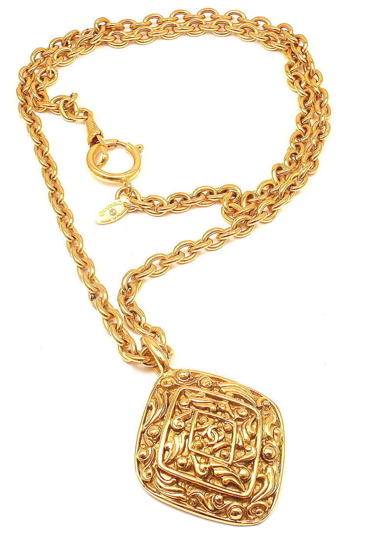 CHANEL Vintage Long Textured Amulet Logo Necklace In New Condition In Holland, PA