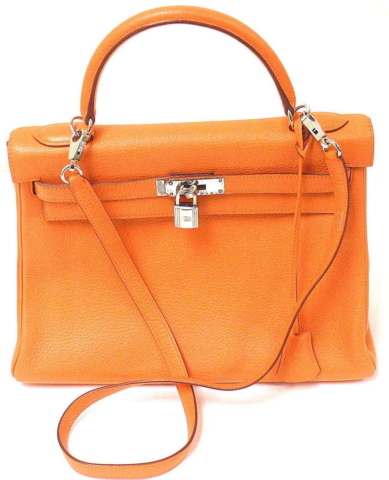 HERMES 32CM ORANGE CLEMENCE SHOULDER KELLY HANDBAG, YEAR 2003
*Please note, color may not be fully representative of handbag based on monitor and lighting. This handbag is the signature Hermes orange with matching orange stitching.

Beautiful
