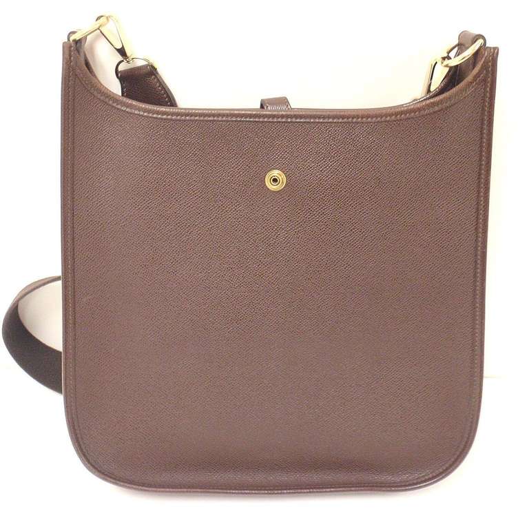 HERMES EVELYNE PM BROWN EPSOM LEATHER GHW SHOULDER BAG, 2004

 This bag is in GREAT condition. Features thick , sturdy epsom leather exterior with sueded leather interior. 

Color will vary from monitor to monitor. This is a rich chocolate brown