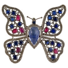 Colgante de mariposa calado con silvorra, tanzanita, kynita, rubí y diamantes, en plata 925