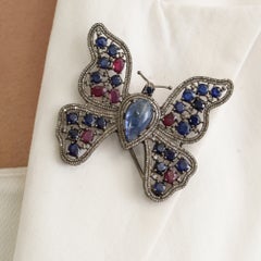 Colgante de mariposa calado con silvorra, tanzanita, kynita, rubí y diamantes, en plata 925