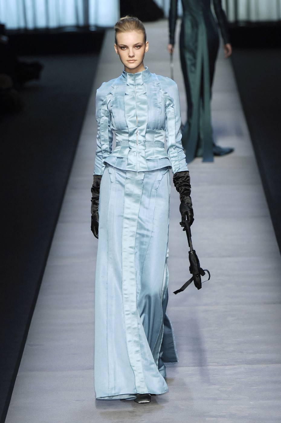 Label: Rochas
Collection: Paris Fall 2005 RTW
Designer: Olivier Theyskens
Description: Ethereal pale blue suit jacket with long skirt. The jacket features as waistband and panels matching the skirt. 
Size: French 40
Retailed for $13,000

