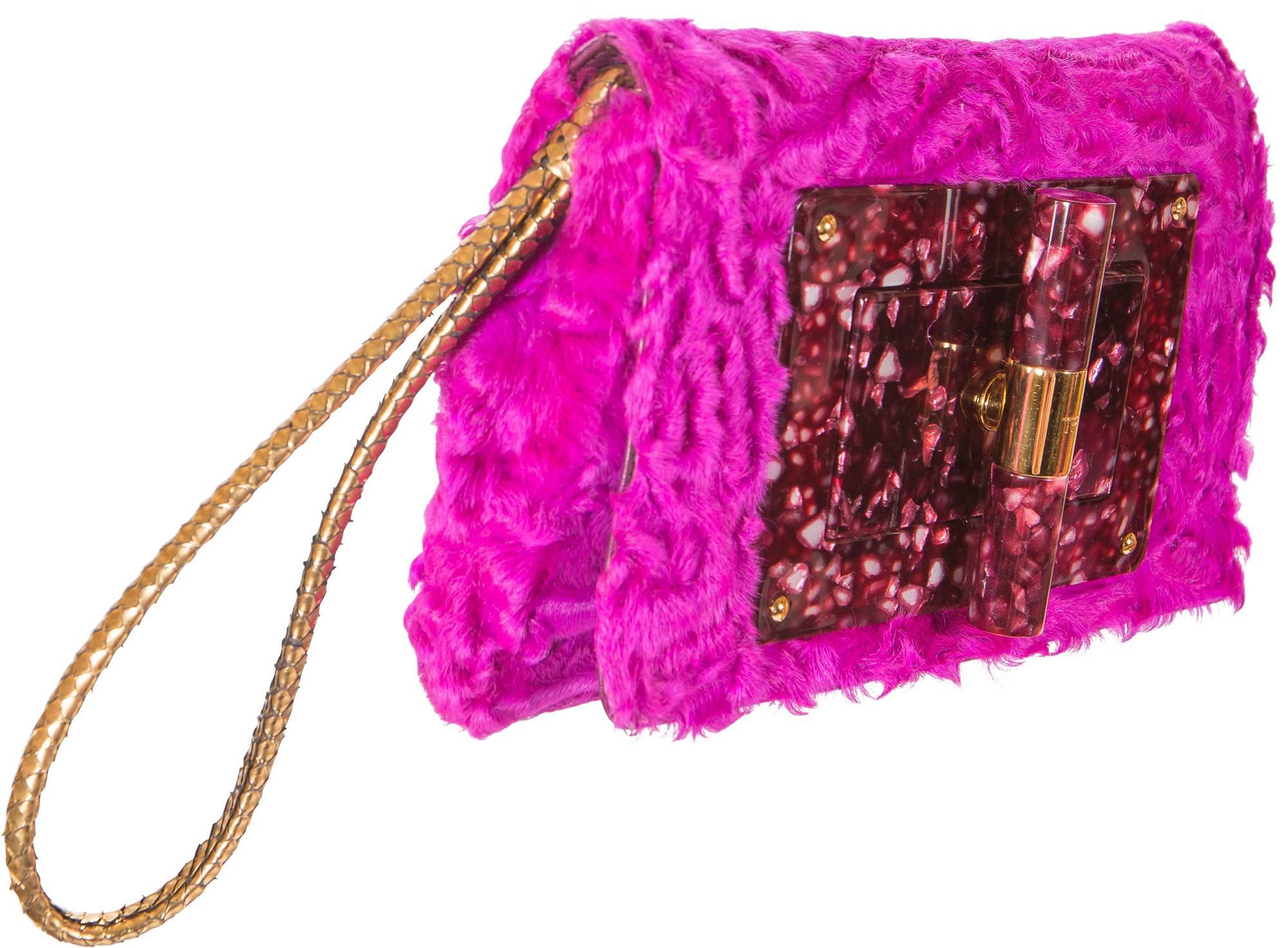 Fuchsia Astrakhan or Broadtail fur Tom Ford Natalia bag 
Gold-tone hardware with gold snake skin strap.
Burgandy lucite detail at front.
Single pocket at back.
Silk interior lining. 
Turn-lock closure at front face.  

RRP $19,500