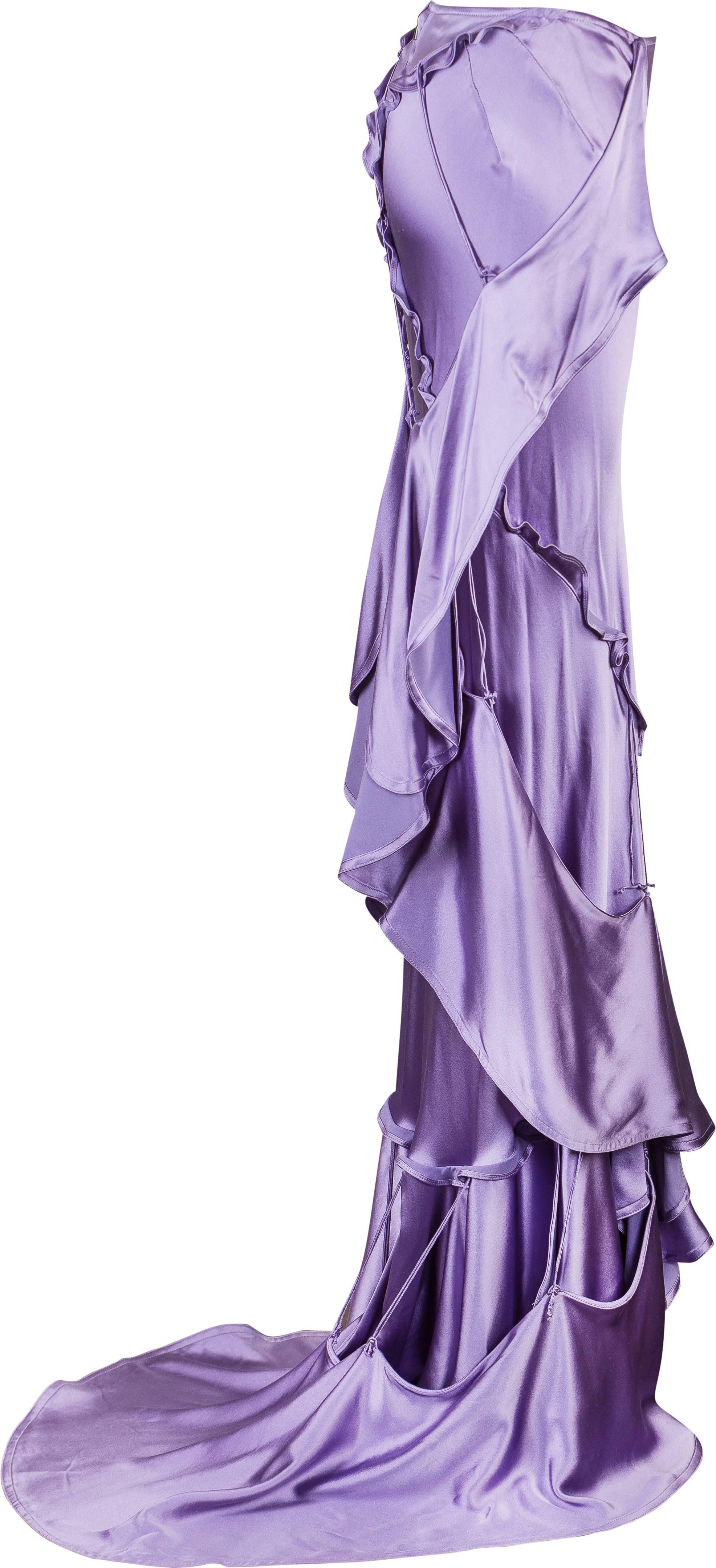 Yves Saint Laurent Fall 2003 Lilac Silk Evening Skirt
Designed by Tom Ford
Interesting detail throughout skirt, ruffles, drapes and train
Secured with a YSL metal zip at the back
FR38