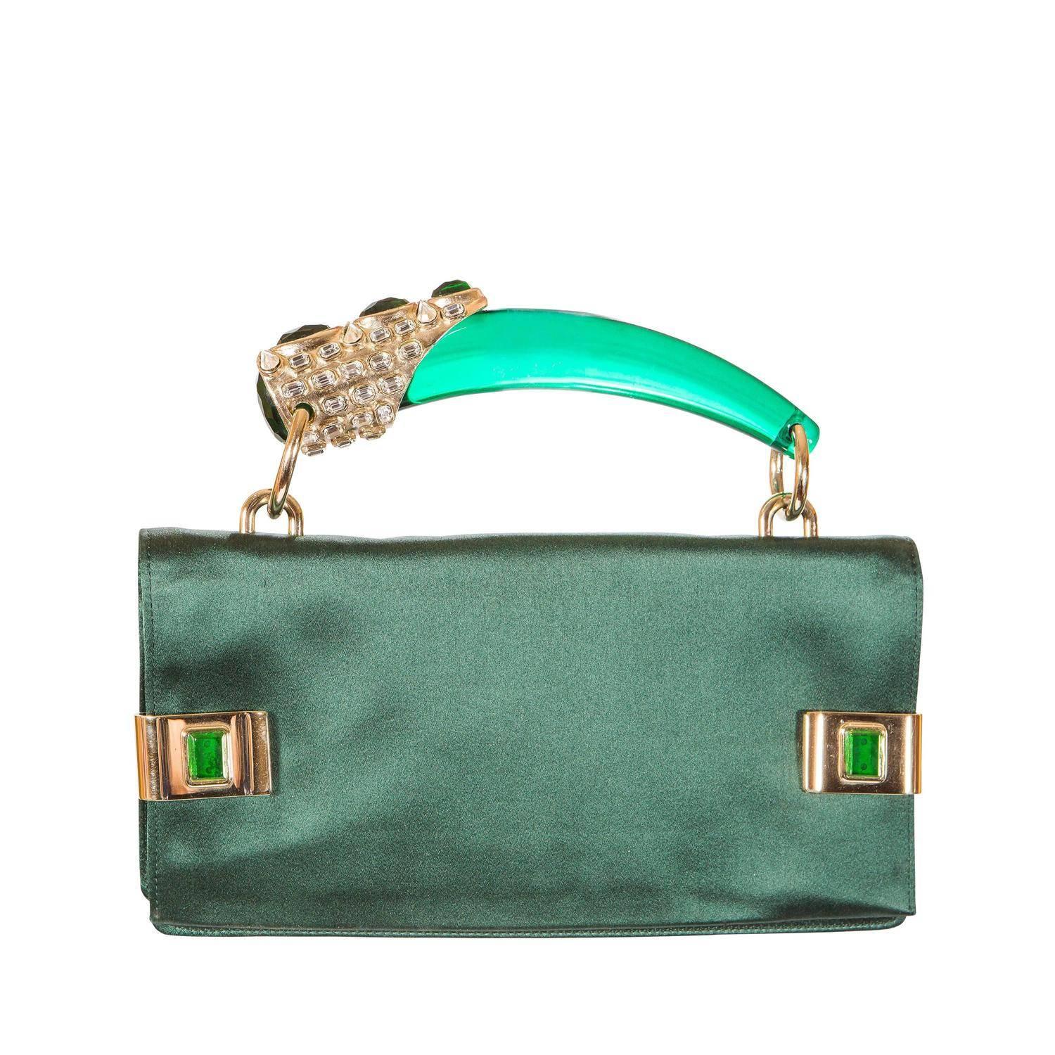 Sample - only one ever made
Tom Ford for Yves Saint Laurent Spring 2004 
Emerald Jeweled Bag with lucite horn handle
Emerald Silk with gold hardware and green and white jewels
Gold jeweled clips open at side.