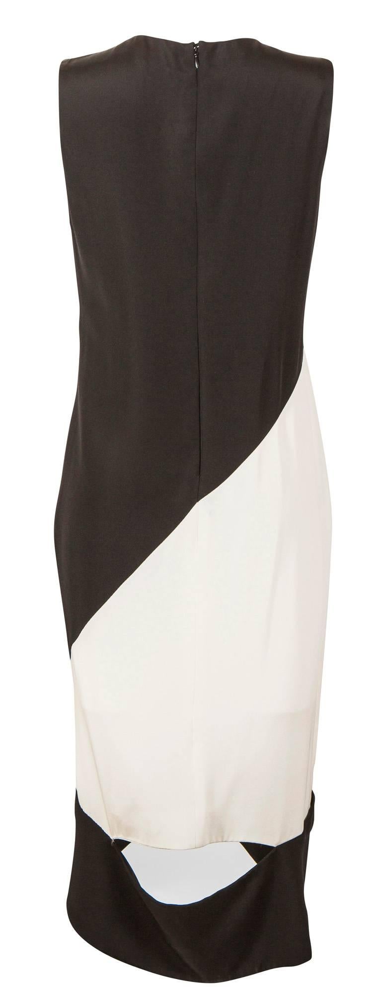 Label: Tom Ford
Collection: Spring/Summer 2013
Designer: Tom Ford
Description: Black and White silk geometric panel evening dress with sheer panel at front, and split detail at the back of the dress. 
Size: Italian 40