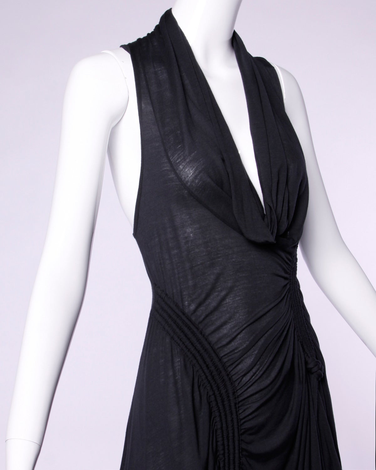 Unique parachute-inspired jersey knit dress by CoSTUME NATIONAL. Cowl neck and asymmetric front ruching.

Details:

Unlined
No Closure/ Fabric Contains Stretch
Marked Size: Not Marked
Color: Dark Gray
Fabric: Paper Thin Jersey Knit
Label: CoSTUME