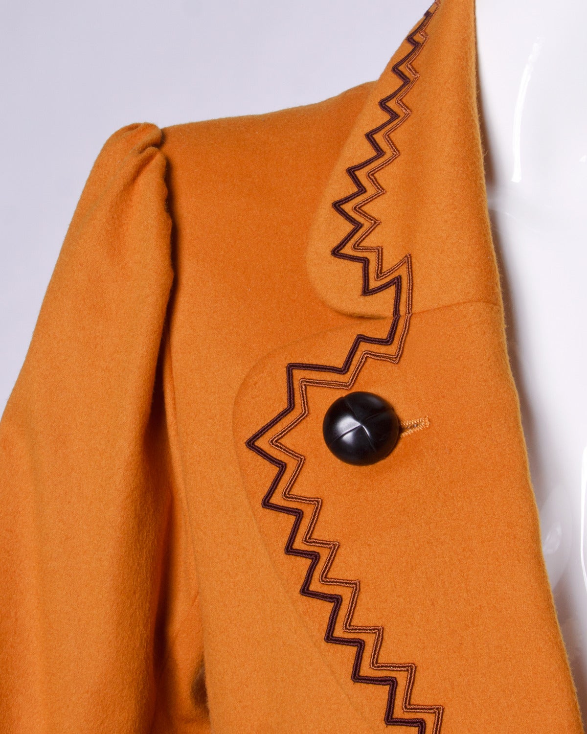 Gorgeous YSL vintage blazer jacket in warm rust wool. Zigzag trim, rounded lapels and patch pockets. So well tailored!

Details:

Fully Lined
Front Pockets
Shoulder Pads Sewn Into Lining
Marked Size: 36
Color: Rust
Fabric: Feels like