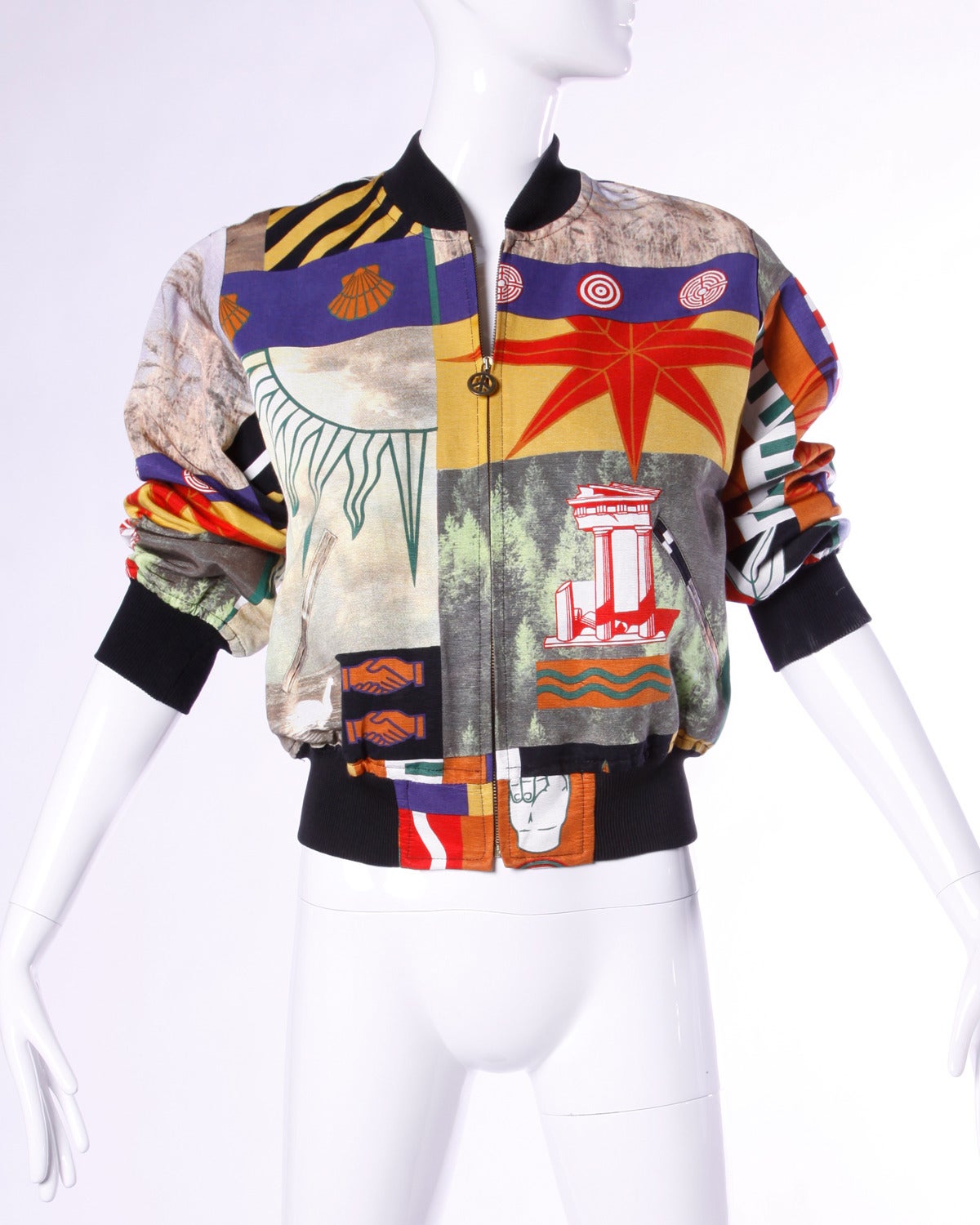 Vintage bomber jacket featuring a collage of photo and graphic prints by Moschino. Timeless iconic design and rare collector's piece! This jacket zips up the front with a metal zipper and peace sign pull.

Details:

Fully Lined
Front Metal Zip