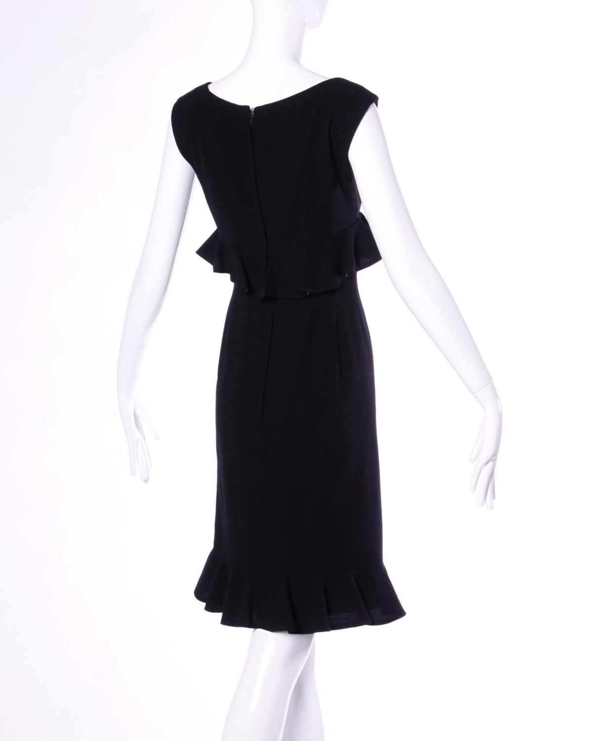Flattering vintage cocktail dress by one of our favorite vintage designers: Wilson Folmar for Edward Abbott. Simple and chic with ruffles that accentuate the tiny waist on this dress. 

Details:

Fully Lined
Back Zip and Hook Closure
Estimated