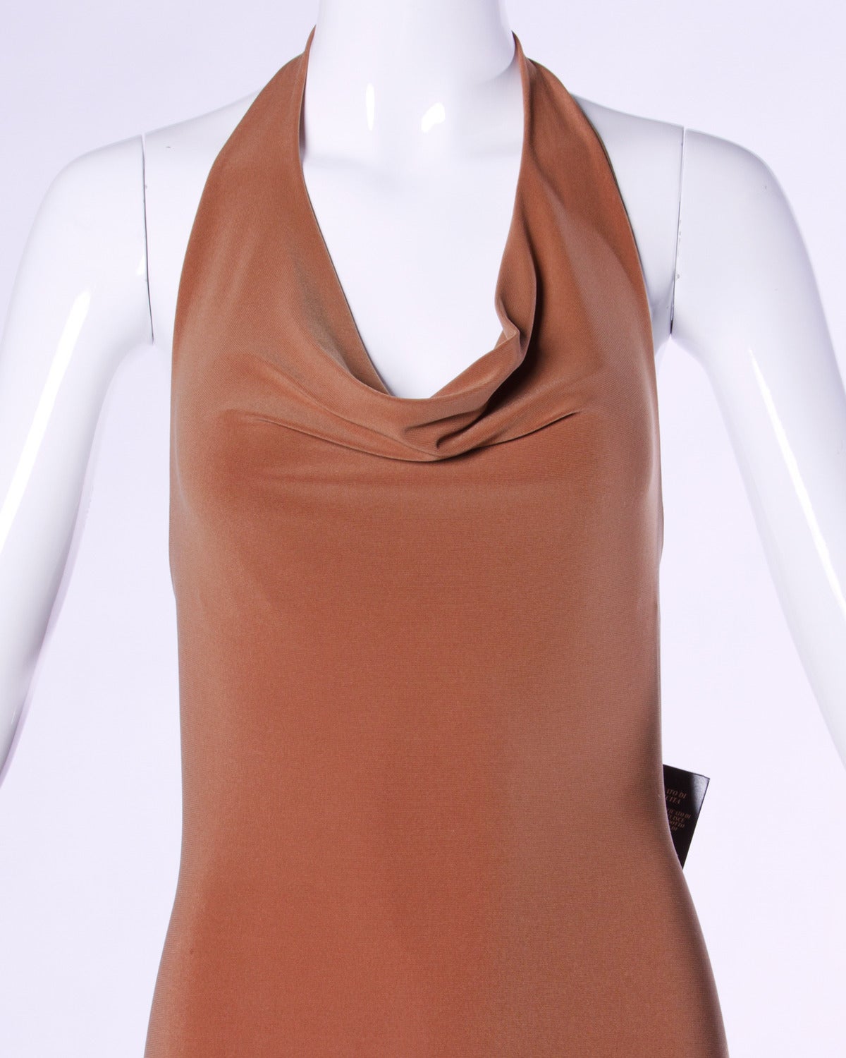 Unworn with the original tags still attached! Deadstock jersey knit halter dress by Prada.

Details:

Unlined
No Closure/ Fabric Contains Stretch
Circa: 1990's
Marked Size: L
Estimated Size: M-L
Color: Dark Tan
Fabric: Cotton/